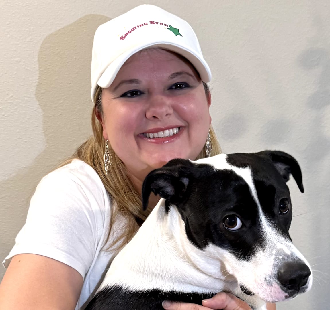 Michelle Sawyer founder of Shooting Star Products with her dog, reflecting the brand's family and pet friendly values