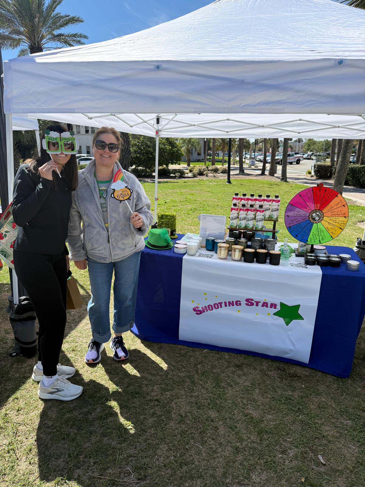 Shooting Star Products showcasing handcrafted candles and probiotic cleaning products at the Jax Beach Market in Jacksonville Beach, Florida